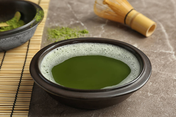 Chawan with fresh matcha tea on table - Фото, зображення