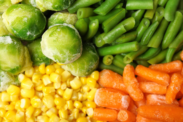 Mix of frozen vegetables as background, top view - Photo, Image