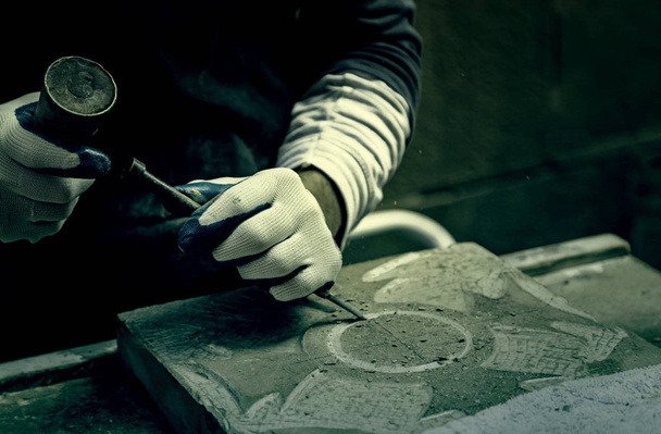 Man carving stone detail of a traditional craftsman working stone worker, crafts - Photo, Image