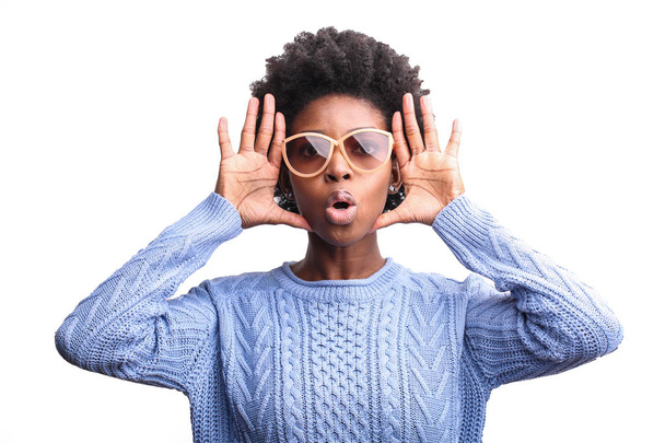 Young beautiful Afro woman in sunglasses making a funny face. - Foto, imagen