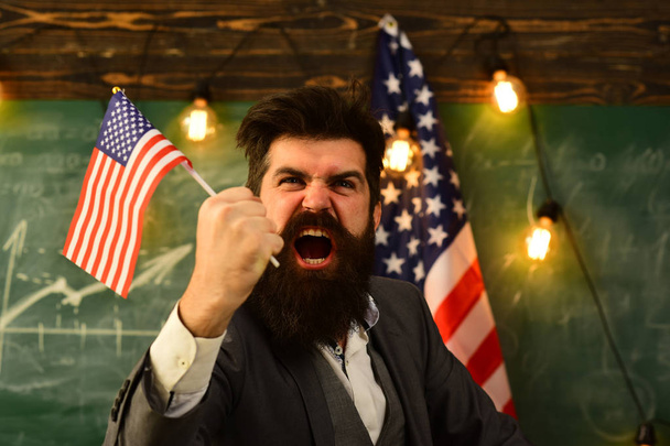 shouting businessman with american flag and raised hand. - Photo, Image