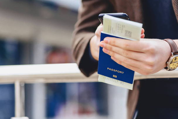 closup phone passport and tickets in urban context - Fotografie, Obrázek