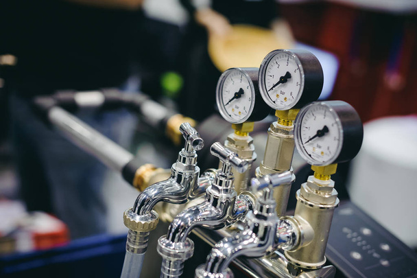 Thermometer, pipes and faucet valves of heating system in a boiler room. - Фото, изображение