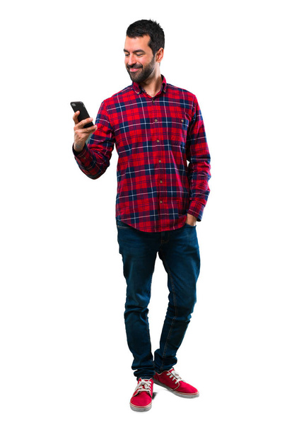 Handsome man using mobile phone - Foto, afbeelding