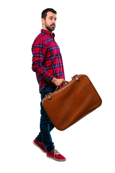 Handsome man holding a vintage briefcase - Valokuva, kuva