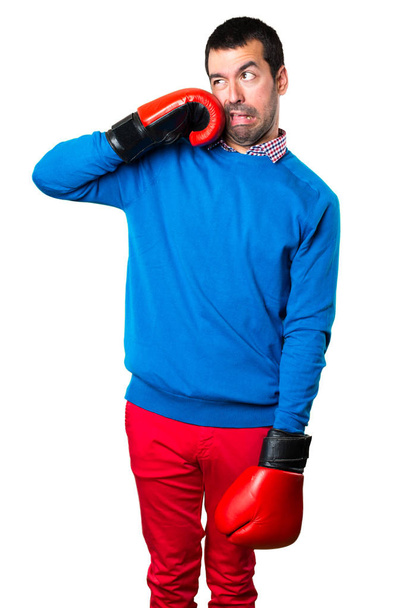 Handsome young man with boxing gloves on white background - Fotografie, Obrázek