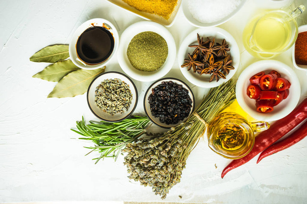 Organic food concept with different spices and herbs on  rustic background with copy space - Fotografie, Obrázek