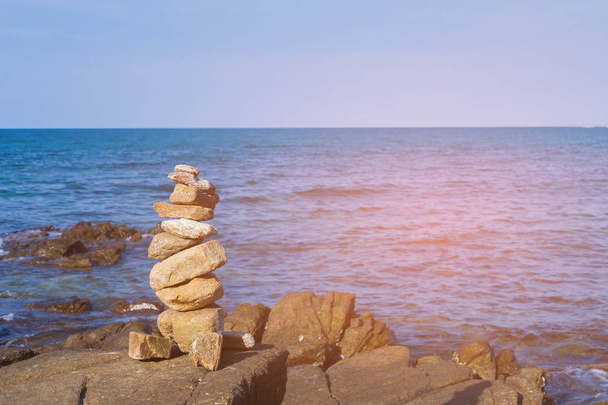 Stack balance stone over seacoast skyline, abstract background - Photo, Image