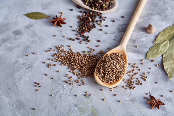 Coriander in wooden spoon with clipping path on white textured background, close-up, selective focus. - Φωτογραφία, εικόνα