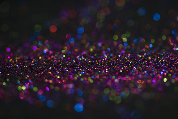 Bokeh glitter fly and lights on black background - Photo, Image