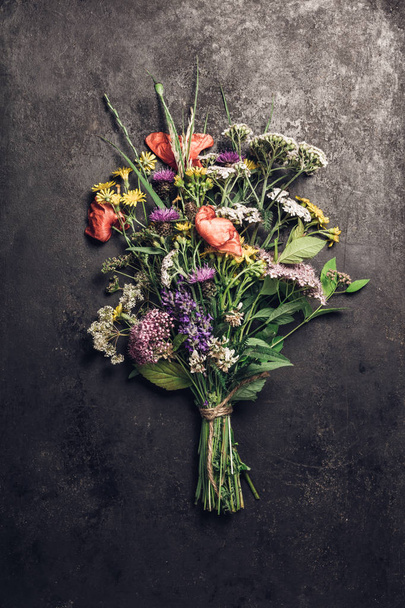 Wild flower bouquet on vintage background. Top view, flat lay - Fotoğraf, Görsel