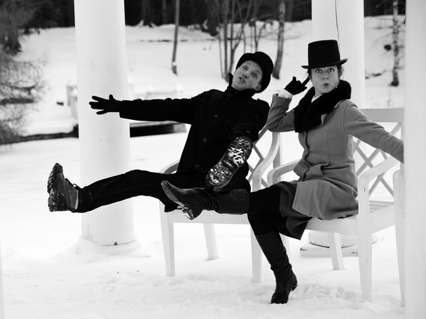 Shaded man and woman worming at chairs - Valokuva, kuva