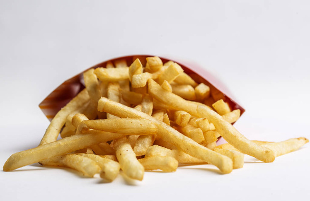 Fritas fritas fritas com ketchup em fundo de madeira
 - Foto, Imagem