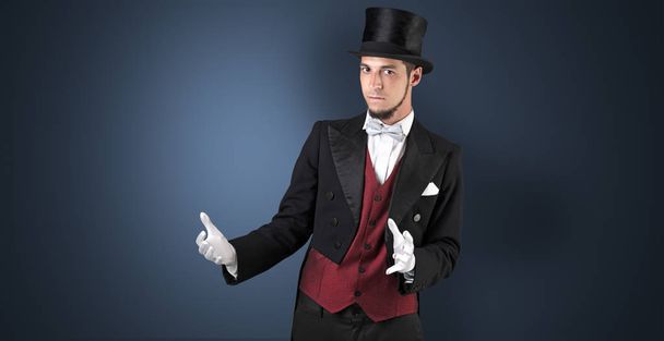Magician holds something invisible  - Zdjęcie, obraz
