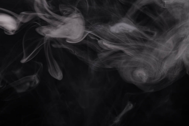Cloud of smoke on black background. Selective focus. - Foto, Bild