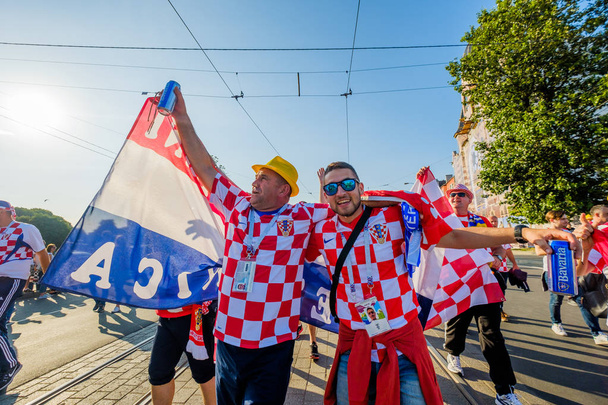 Football fans support teams on the streets of the city on the day of the match between Croatia and Nigeria - Valokuva, kuva