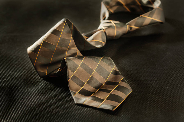 male tie on dark background - Foto, imagen