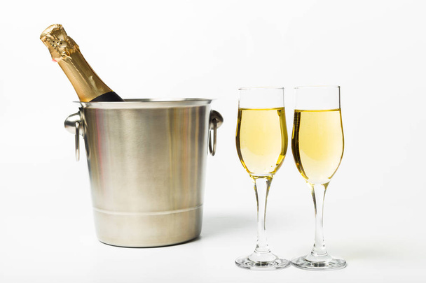 Detail view of champagne bottle and glasses on white background - Foto, immagini