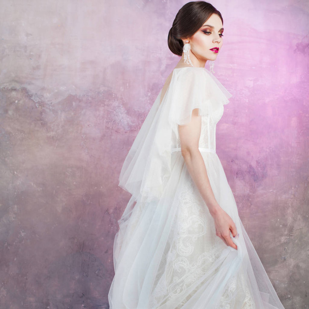 Beautiful and stylish bride in wedding dress in Studio - Photo, Image