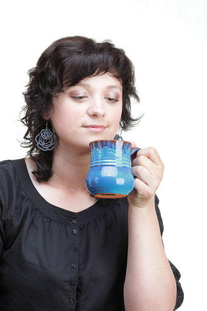 woman holding a blue cup, isolated - Photo, Image