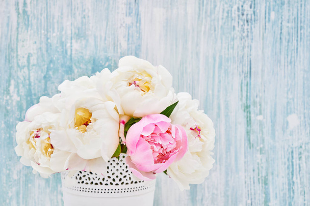 White peonies bouquet on blue background. Holiday background, copy space. Valentine Day, Mothers day, Birthday concept. - Photo, Image