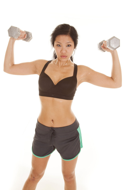 Asian woman black top weight up look - Foto, Imagen
