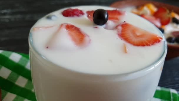 yoghurt raspberry strawberry blueberry drops slow-motion - Footage, Video