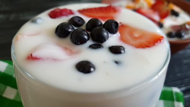 yoghurt raspberry strawberry blueberry spoon slow-motion shot - Footage, Video