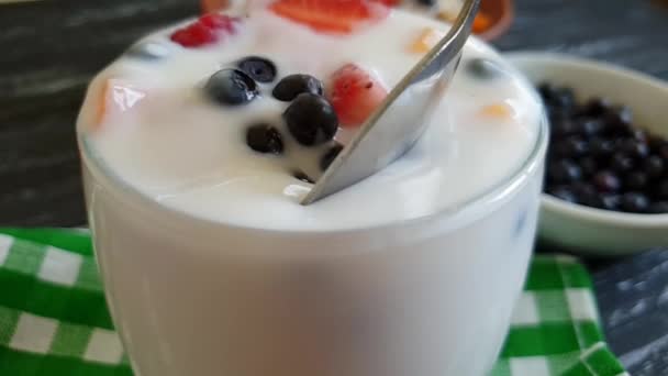 yoghurt raspberry strawberry blueberry spoon slow motion - Footage, Video