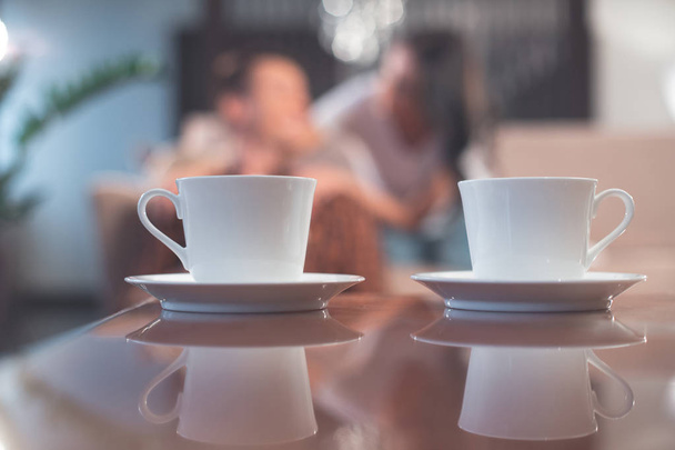 Mugs of hot beverage create romantic atmosphere  - Foto, imagen