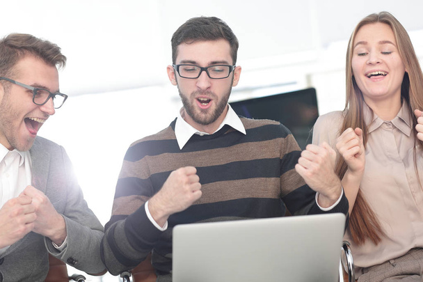 Three excited employees receiving good news together on line - Photo, Image