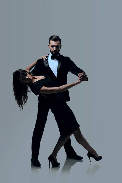 Attractive young couple dancing in studio. - Photo, Image