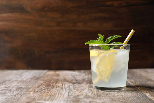 Natural lemonade with mint in glass on wooden table - Φωτογραφία, εικόνα