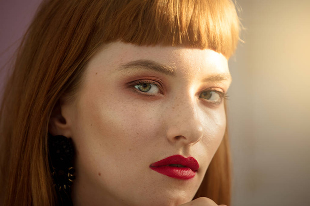 Closeup beauty portrait of natural redhead young woman with red lipstick.  - 写真・画像