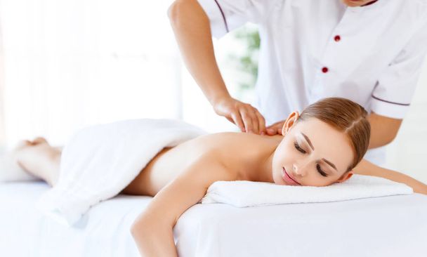 a beautiful girl enjoys massage and spa treatment - Foto, Imagem
