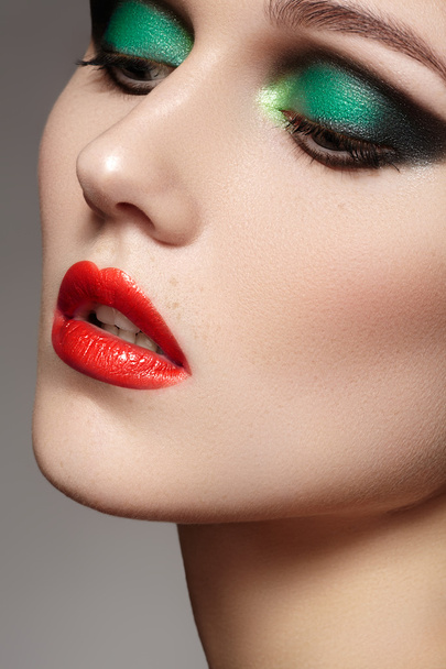 Portrait of beautiful woman's purity face with bright red lips make-up. Cute model with clean shiny skin - Foto, afbeelding