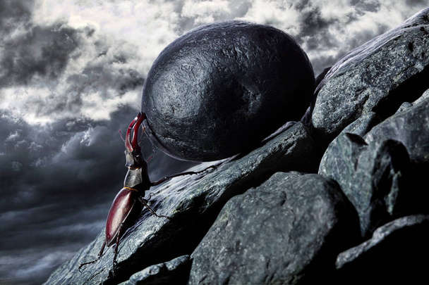 Sisyphus metaphore. Silhouette of businessman pushing heavy stone boulder up on hill. - Photo, Image