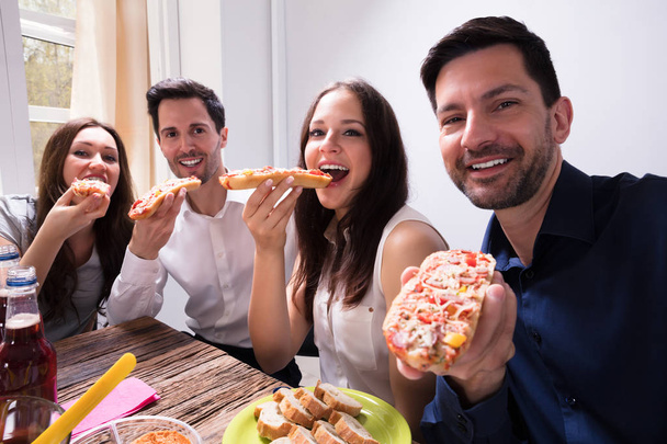 Portrait Of Happy Young Friends Eating Delicious Fresh Bruschetta - Foto, Bild