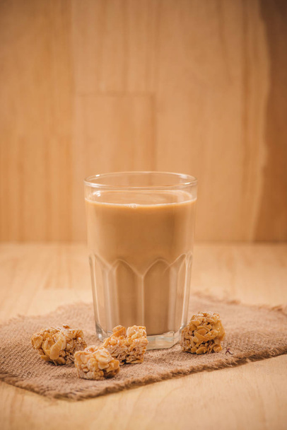 Milk bottle and milk glass on wooden table. Healthy eating concept - Fotografie, Obrázek