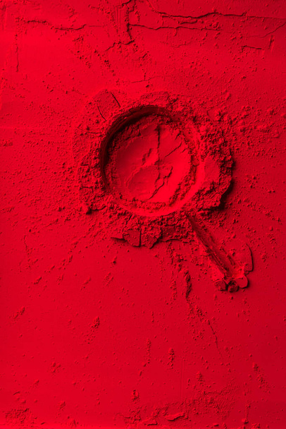 top view of lollipop shape on red powder - 写真・画像