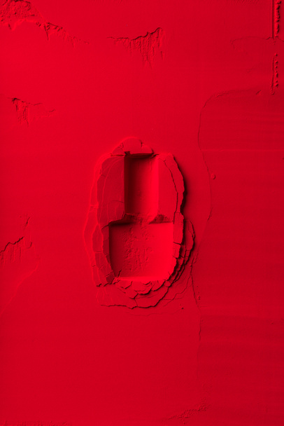 top view of shape of nail polish bottle on red powder - Фото, зображення