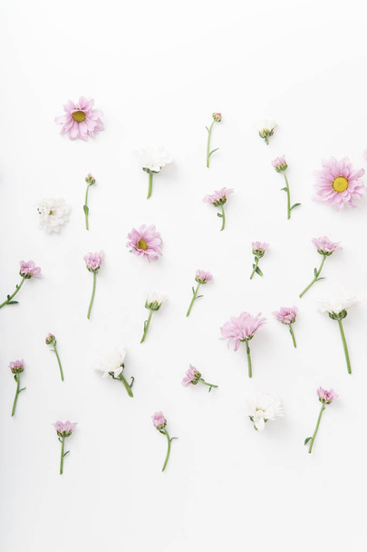Floral pattern with tender pink and white flowers arranged on white background - Photo, image