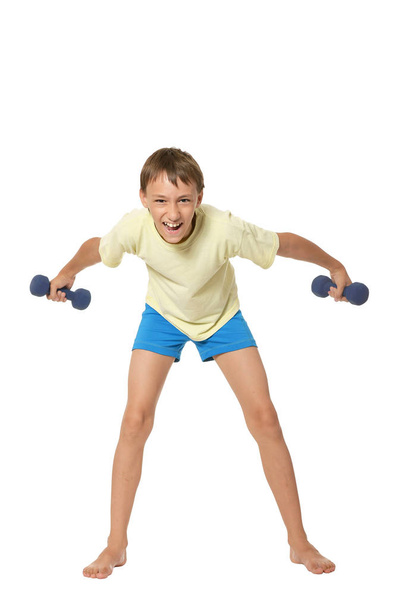 Young boy doing exercises - Foto, Imagen