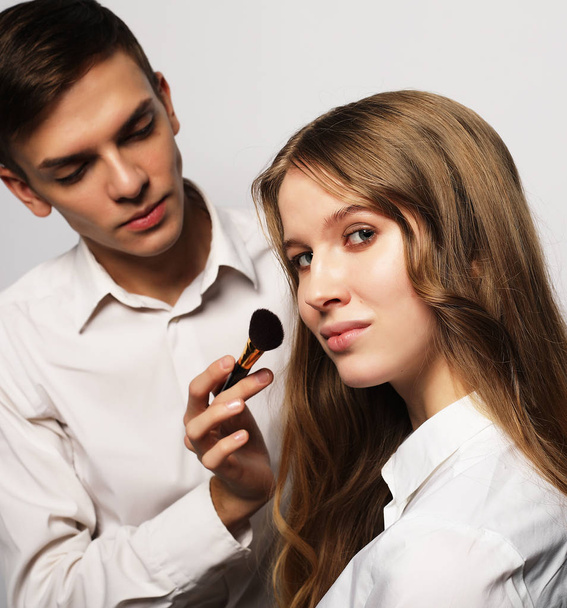 Beauty concept: Make-up artist doing makeup - Foto, Bild