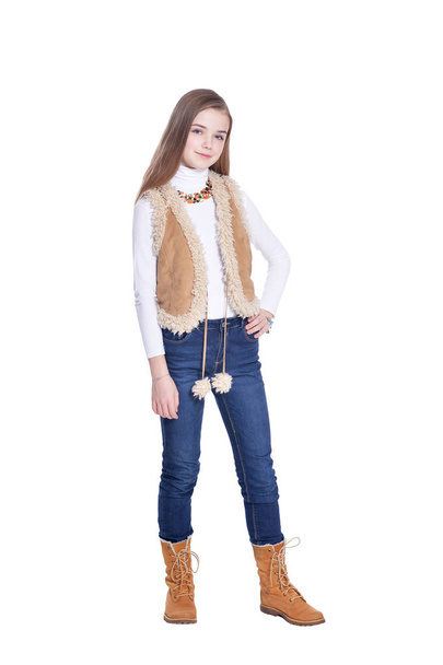 Happy little girl in jeans  posing  isolated on white background - Foto, Imagem