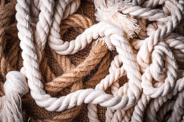 twisted ropes on burlap cloth - Φωτογραφία, εικόνα