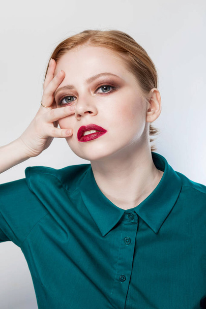 Beautiful redhead girl with professional makeup, close up portrait - Фото, изображение