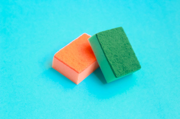 Cleaning sponges  on color background - Fotoğraf, Görsel