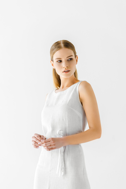 young beautiful woman in linen white dress looking away isolated on grey background  - Photo, image