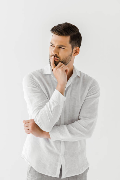 thoughtful man in linen white shirt isolated on grey background  - 写真・画像